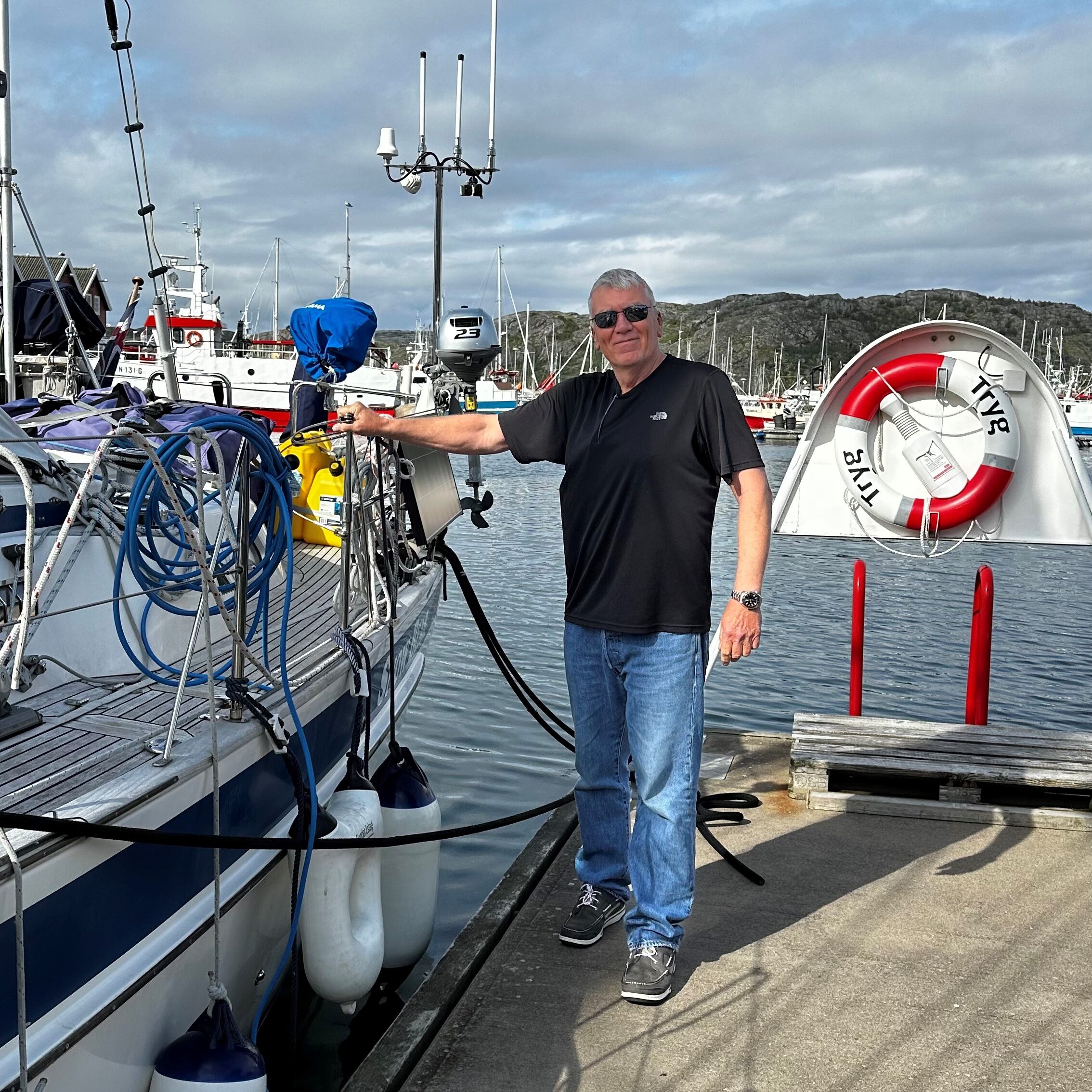 Owner of a sailing boat on a dock in norway