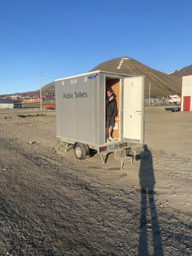 The public toilet that is very small on the street