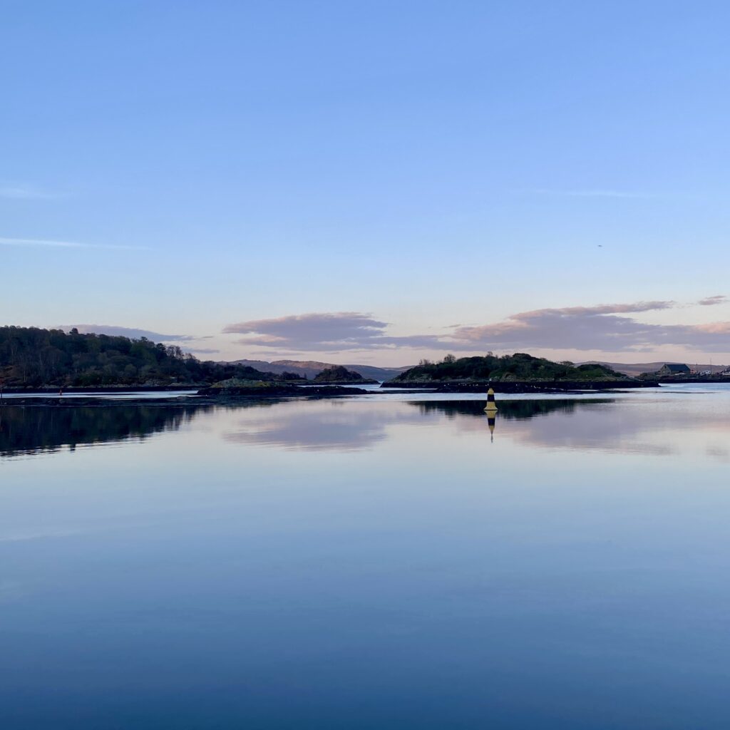 Landscape mirrored in calm sea